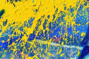 A fragment of colorful graffiti painted on a wall. Abstract urban background. photo