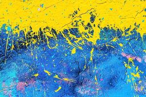 A fragment of colorful graffiti painted on a wall. Abstract urban background. photo
