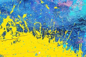 A fragment of colorful graffiti painted on a wall. Abstract urban background. photo