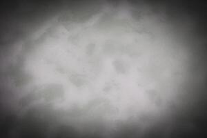 Blured gray decorative plaster or concrete background with vignette. photo