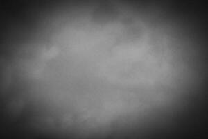 Blured gray decorative plaster or concrete background with vignette. photo