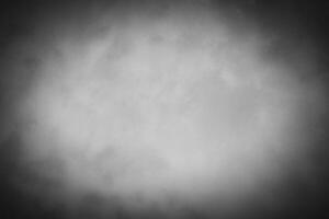 Blured gray decorative plaster or concrete background with vignette. photo