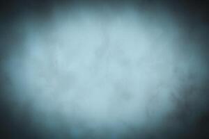 Blured monochrome decorative plaster or concrete background with vignette. photo