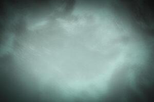 Blured monochrome decorative plaster or concrete background with vignette. photo