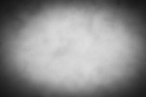 Blured gray decorative plaster or concrete background with vignette. photo