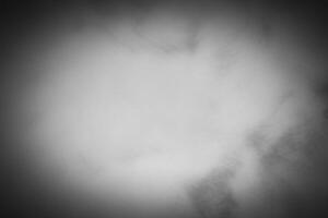 Blured gray decorative plaster or concrete background with vignette. photo