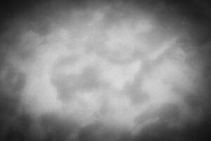 Gray decorative plaster or concrete background with vignette. photo