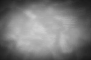 Blured gray decorative plaster or concrete background with vignette. photo
