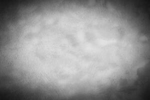 Gray decorative plaster or concrete background with vignette. photo