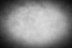 Gray decorative plaster or concrete background with vignette. photo