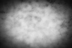 Gray decorative plaster or concrete background with vignette. photo