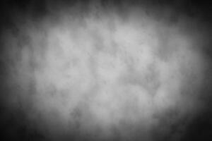 Gray decorative plaster or concrete background with vignette. photo