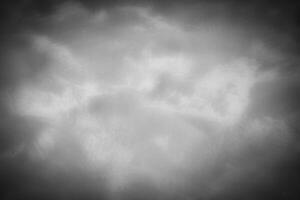Gray decorative plaster or concrete background with vignette. photo