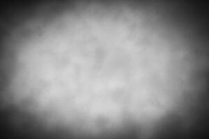 Gray decorative plaster or concrete background with vignette. photo