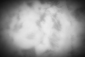 Gray decorative plaster or concrete background with vignette. photo
