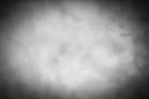 Gray decorative plaster or concrete background with vignette. photo