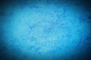 Texture of blue decorative plaster or concrete with vignette. photo