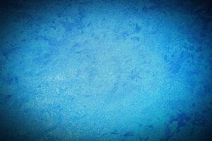 Texture of blue decorative plaster or concrete with vignette. photo