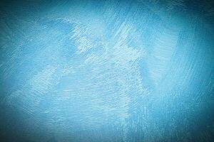 Texture of blue decorative plaster or concrete with vignette. photo