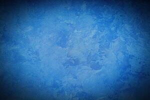 Texture of blue decorative plaster or concrete with vignette. photo