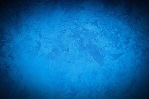 Texture of blue decorative plaster or concrete with vignette. photo