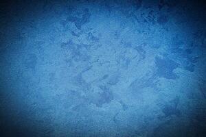 Texture of blue decorative plaster or concrete with vignette. photo