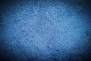 Texture of blue decorative plaster or concrete with vignette. photo