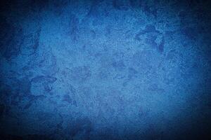 Texture of blue decorative plaster or concrete with vignette. photo
