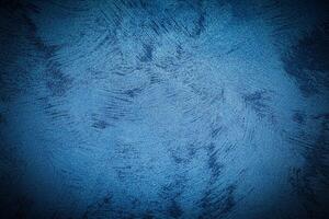 Texture of blue decorative plaster or concrete with vignette. photo