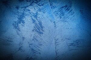 Texture of blue decorative plaster or concrete with vignette. photo