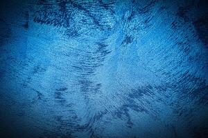 Texture of blue decorative plaster or concrete with vignette. photo