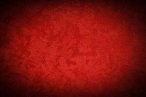 Texture of red decorative plaster or concrete with vignette. photo