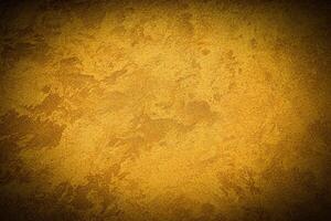 Texture of golden decorative plaster or concrete with vignette. photo