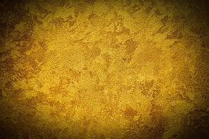 Texture of golden decorative plaster or concrete with vignette. photo