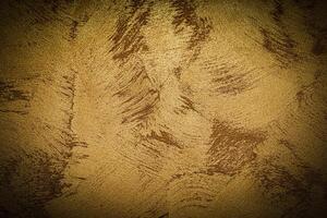 Texture of golden decorative plaster or concrete with vignette. photo