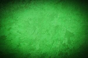 Texture of green decorative plaster or concrete with vignette. photo
