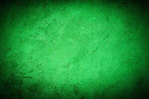 Texture of green decorative plaster or concrete with vignette. photo