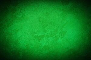 Texture of green decorative plaster or concrete with vignette. photo