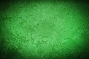 Texture of green decorative plaster or concrete with vignette. photo