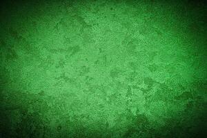 Texture of green decorative plaster or concrete with vignette. photo