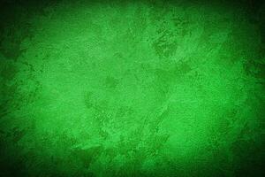 Texture of green decorative plaster or concrete with vignette. photo