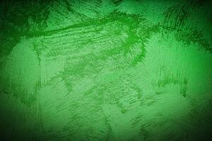 Texture of green decorative plaster or concrete with vignette. photo