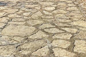 Old cobblestone pavement texture. Ancient sidewalk background. photo