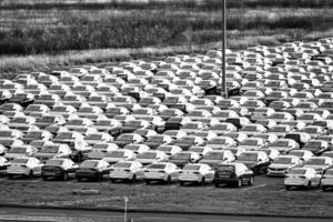 Volkswagen Group Rus, Russia, Kaluga - NOVEMBER 17, 2020 Rows of a new cars parked in a distribution center. Parking in the open air. photo