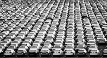 Volkswagen Group Rus, Russia, Kaluga - NOVEMBER 17, 2020 Rows of a new cars parked in a distribution center. Parking in the open air. photo