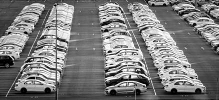 Volkswagen Group Rus, Russia, Kaluga - NOVEMBER 17, 2020 Rows of a new cars parked in a distribution center. Parking in the open air. photo
