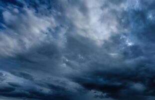 Dark storm clouds. An impending storm, hurricane or thunderstorm. Bad extrime weather. photo