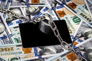 Dollar bills and white debit card with copy space for a text. photo