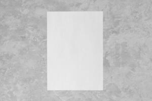 White paper on a gray decorative plaster. Abstract background for design photo
