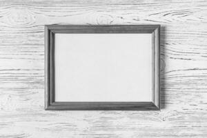 Wooden floor over concrete or decorative plaster wall and photo frame with copy space for a text background.